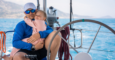 Father with a kid sailing
